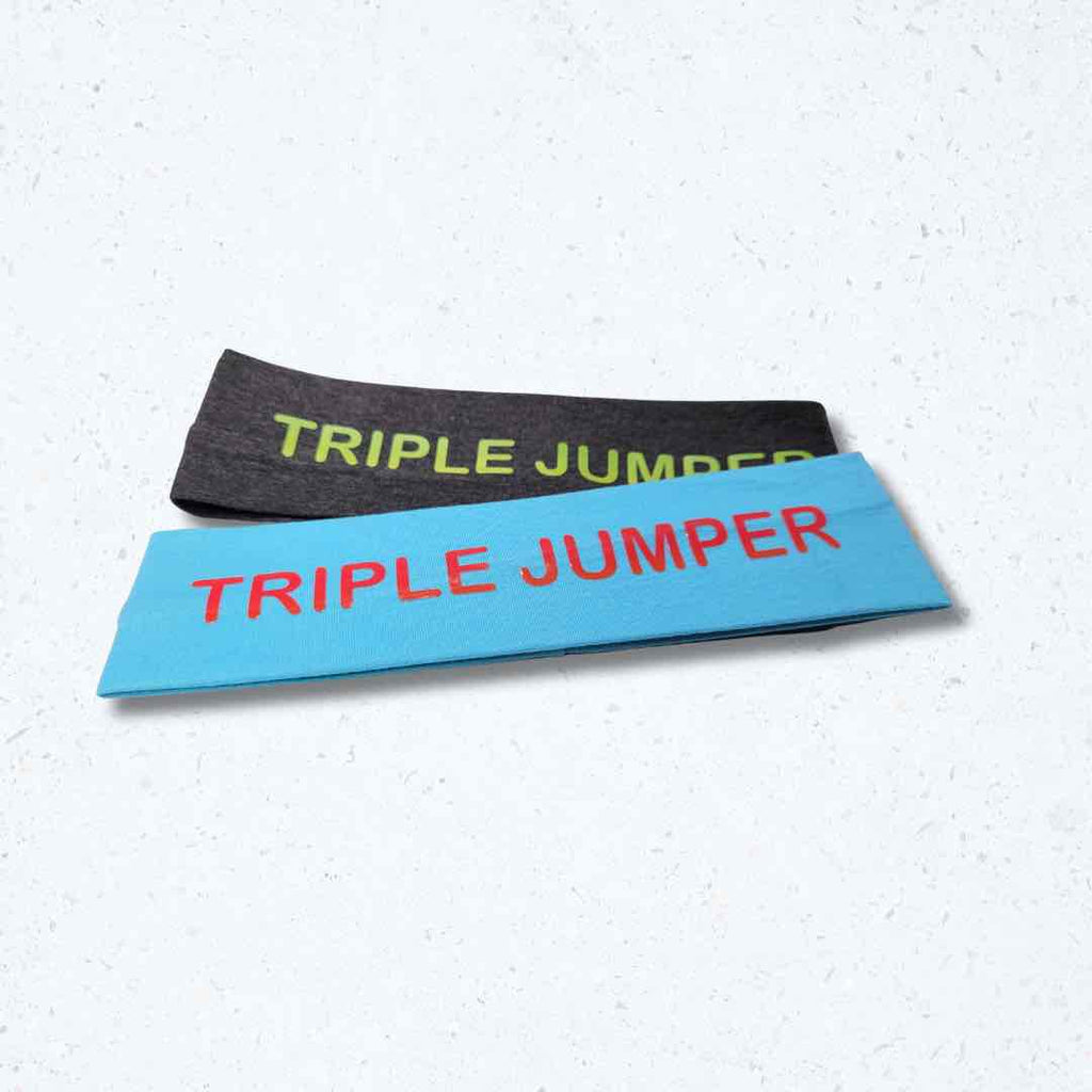 This 'Triple Jumper Headband' with 'TRIPLE JUMPER' lettering print on it, demonstrates both style and practicality for athletes. With a silicone hold, this headband stays beautifully in place.