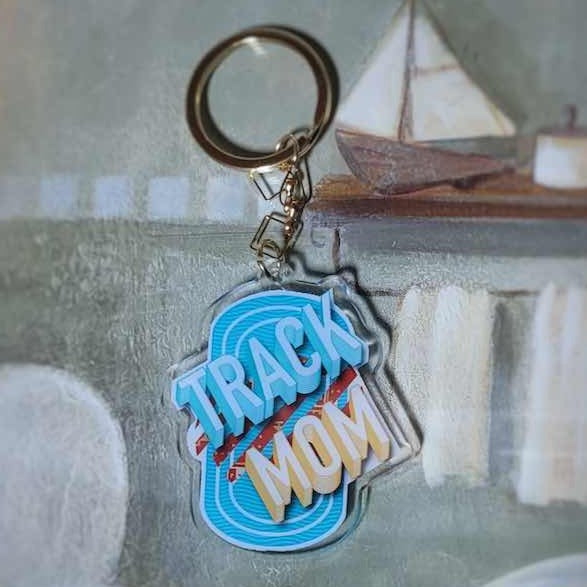Beautifully illustrated Track Mom keychain. This Track Mom themed keychain is perfect for the mother in your life. Works great when used as a bag charm accessories and key ring for all your keys.