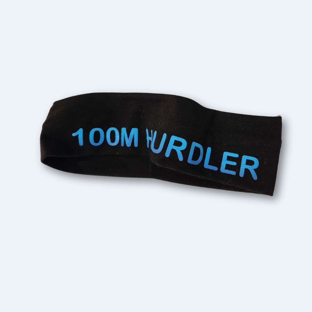 100M Hurdler Headband with the words '100M HURDLER' printed in bold letters, showcasing its style and functionality for track and field athletes. Made with 100% cotton for absolute comfort.