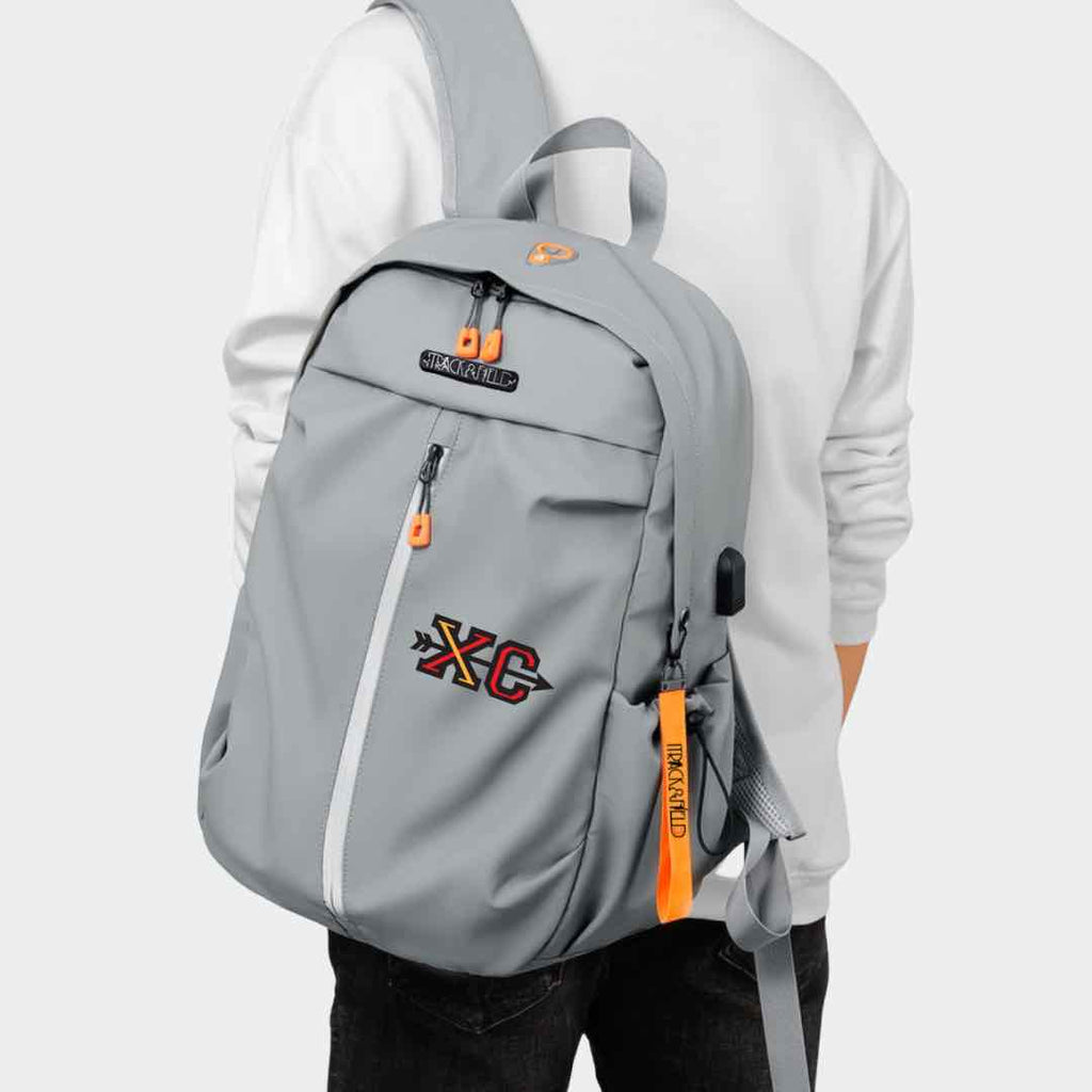 This grey backpack with a colorful yellow and red print of ‘XC’ with an arrow crossing the letters in the middle. This backpack is uniquely designed for track and field athletes. It’s also available in black.