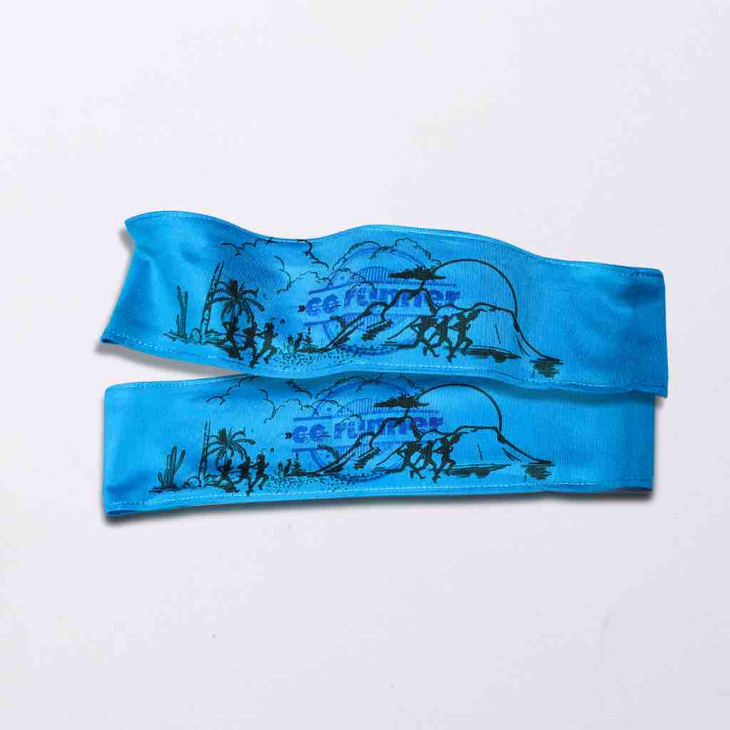 Blue headband with the text "CC Runner" printed in a stamp like design. Made with soft and breathable polyester fabric and wicks away sweat. Ideal for track and field athletics, gym-goers, and sport enthusiasts. 
