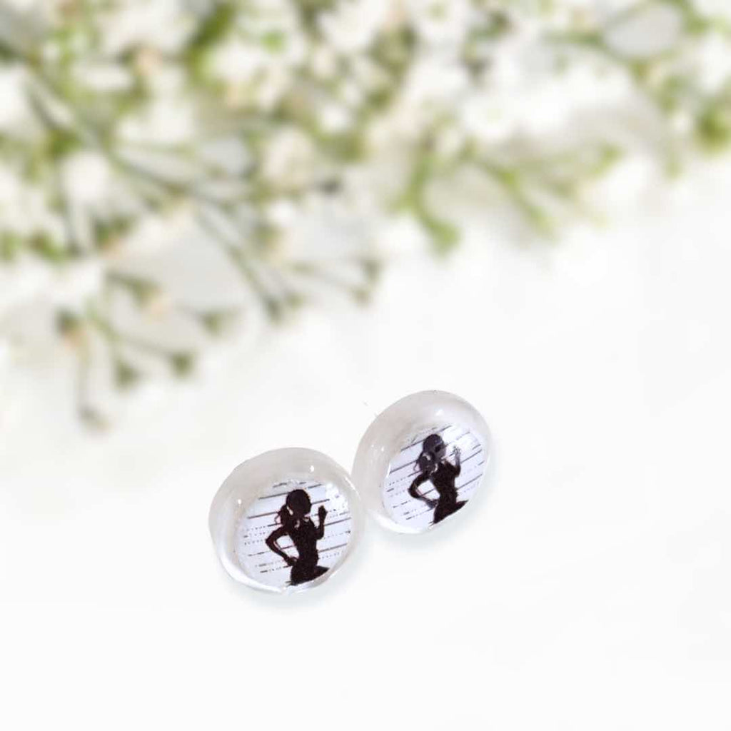 This stud earring has a black female runner silhouette in it. It is handmade with resin, has acrylic backing and stainless-steel poles. It is lightweight and comfortable.
