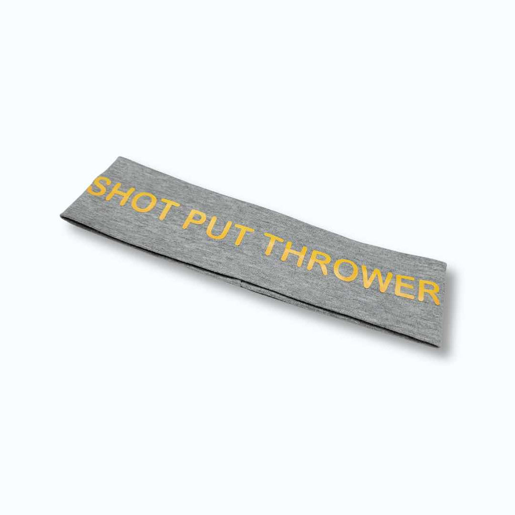 The words "Shot Put Thrower" is boldly printed on this headband. Made from 100% cotton fabric for a comfortable feel and a silicone grip for a firm hold.