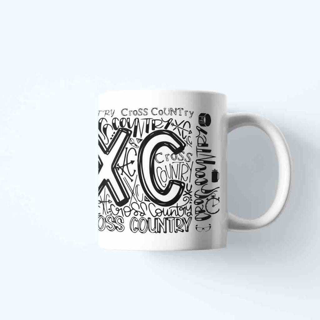 A white ceramic coffee mug with a graffiti-style design featuring the words "XC", and "CROSS COUNTRY" in bold, colorful lettering. It's microwave and dishwater friendly.