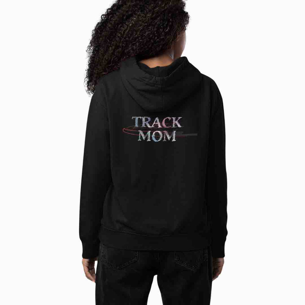 An image of a lady wearing a black hoodie with a bold colorful print of 'TRACK MOM' stylishly placed across the back.  The ideal gift for the track mom who love to crush the morning run or cheer from the sidelines.