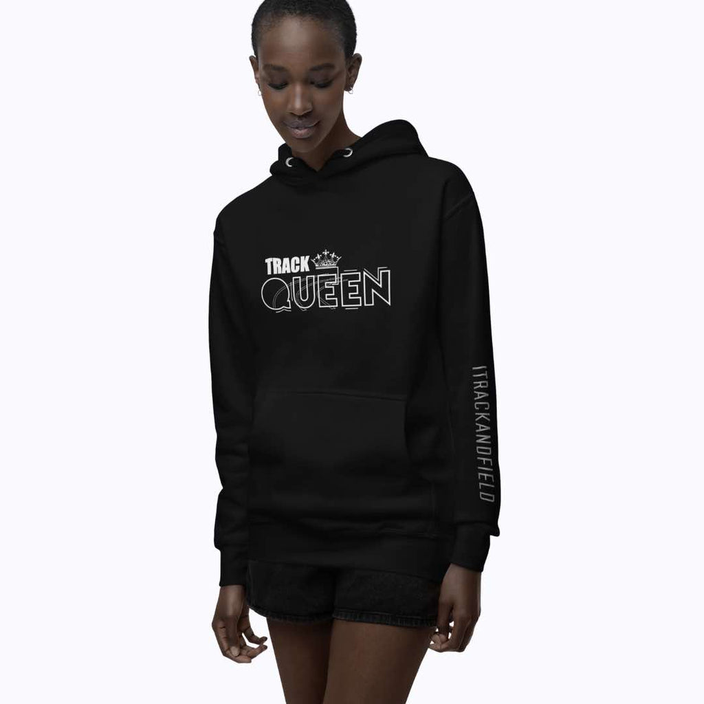 This is an image of a female wearing the “Track Queen Hoodie”. This black hoodie has a white bold print of the text ‘TRACK QUEEN’ and a small image of a crown on the text. It also has ‘ITRACKANDFIELD’ printed in bold letters on the sleeve. It features a double-lined hood with matching drawstring, ribbed cuffs and waistband, and a pouch pocket.