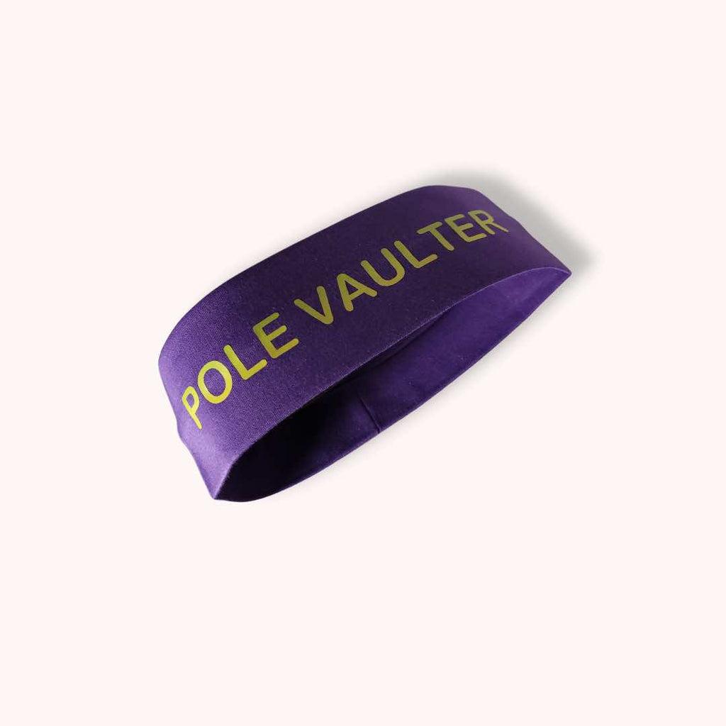 This headband has the words "POLE VAULTER" boldly printed on it in green. It is made from 100% cotton fabric, absolves moisture, and stays in place with the help of the silicone grip. 