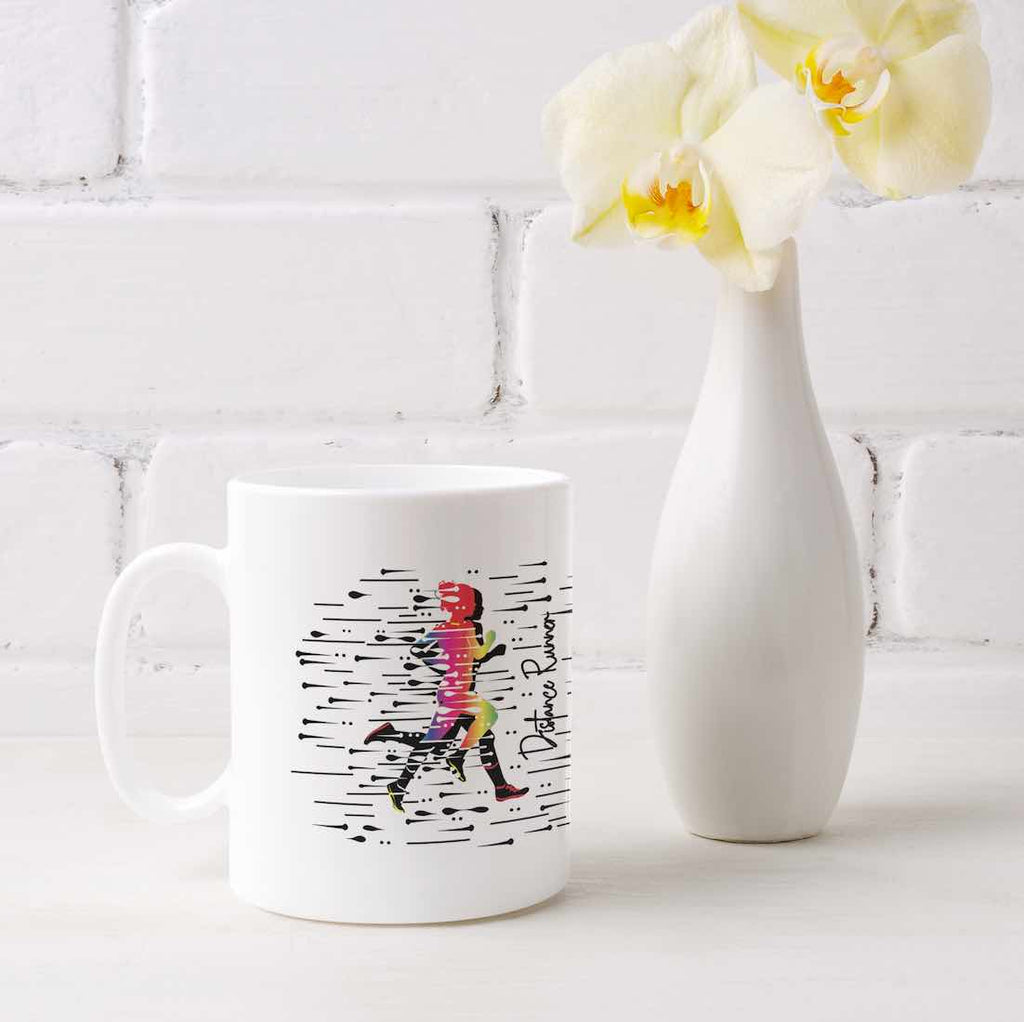 This white coffee mug image has with a colorful female silhouette and the words "Distance Runner" printed on it. It is made from durable ceramic and it's microwave and dishwasher friendly. It is also the ideal gift for any female Distance Runner in your life.